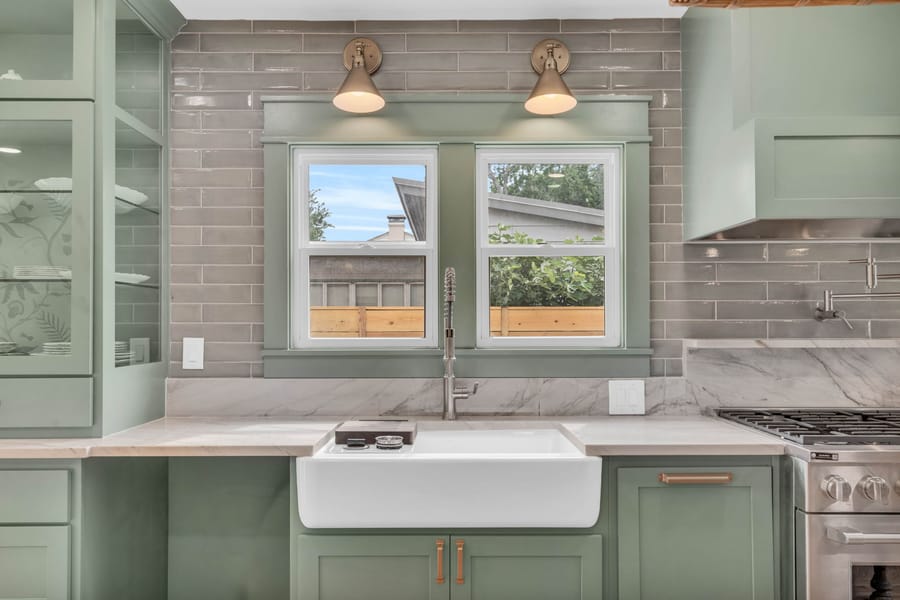 Farmhouse sink and window in a custom kitchen renovation by Vertical Ventures Inc